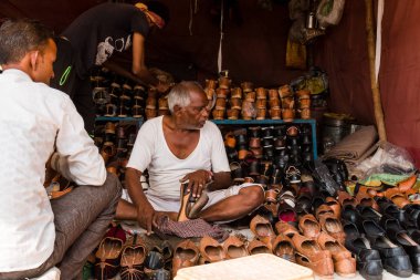 Pushkar, Rajasthan / India - November 2019 : Portrait of street vendors at pushkar fair busy in their activities
