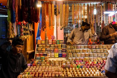 Pushkar, Rajasthan / India - November 2019 :  Shopkeeper at bangles shop at pushkar fair