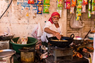 Pushkar, Rajasthan / India - November 2019 : Portrait of street vendors at pushkar fair busy in their activities