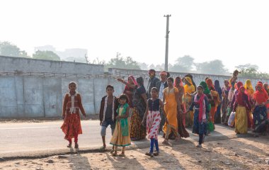 Pushkar, Rajasthan / India - November 2019 : Indian young female participating in pushkar fair in regional dress to attract tourists