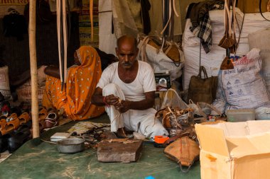 Pushkar, Rajasthan / India - November 2019 : Portrait of street vendors at pushkar fair busy in their activities