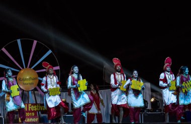 Bikaner, Rajasthan / India - January 2019 : Artists from punjab dance group performing world famous indian folk punjabi bhangra dance at the bikaner camel festival evening