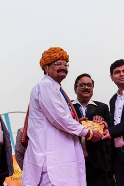 Bikaner, Rajasthan / India - January 2019 : Participants in various activities getting honored by authorities during camel festival clipart