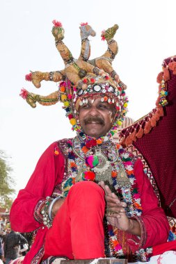 Bikaner, Rajasthan / India - January 2019 : Portrait of rajasthani people  of bikaner in traditional dress and jewelry with long mustache and beard participating in bikaner camel festival