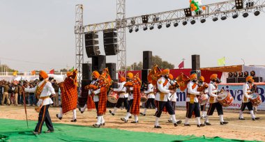 Bikaner, Rajasthan / India - January 2019 :  Bangpiper band performing at bikaner camel fair ground which is lead by sikh sgroup