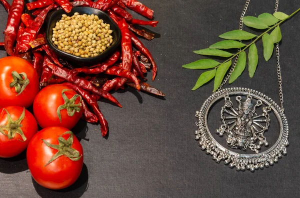 Indian Spices and herbs with Indian Ethnic Jewellery with black wooden background