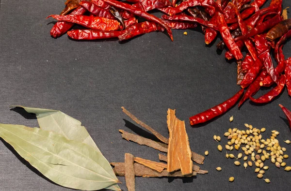 Mix aromatic Herbs and Spices with black wooden background