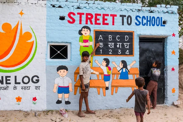 Stock image Poor Indian slum / Village students studying in school with teachers at Noida, India, September 2019