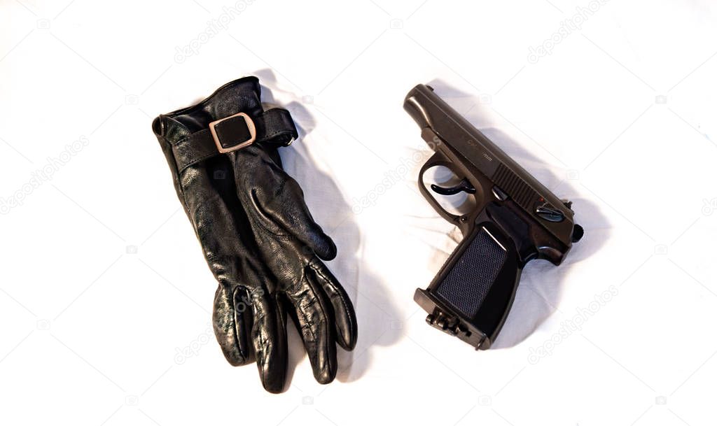 The crime. Contract kill. Killer. Black leather glove and gun on