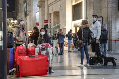 24/02/2020 Milan  - Coronavirus COVID-19 outbreak spreads in Italy. People with facial masks in Central Station.