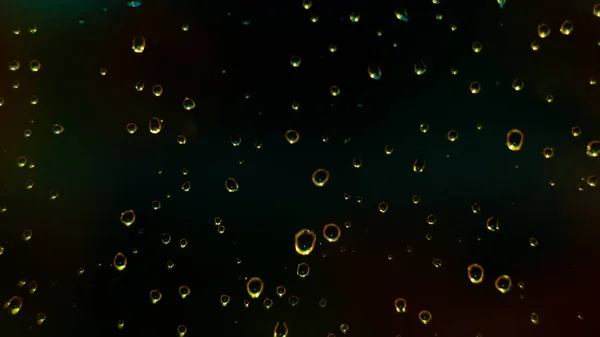 Abstract background with gold drops on glass of black window.