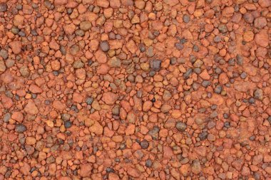 Kırmızı laterite çakıl doku arka planı için.