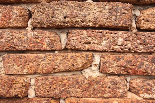 Textura de pared de ladrillo de laterita grunge viejo para fondo . —  Fotos de Stock