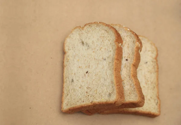 Ψωμί ολικής άλεσης στον φυσικό καφέ υφή φόντου με χώρο για κείμενο. — Φωτογραφία Αρχείου