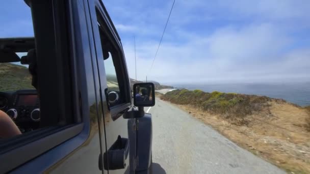 Blond Girl Looks Out Jeeps Window Big Sur Tracking Shot — Stock Video