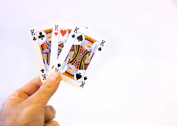 Mão Segurando Trio Cartas Rei Poker Sobre Fundo Branco — Fotografia de Stock