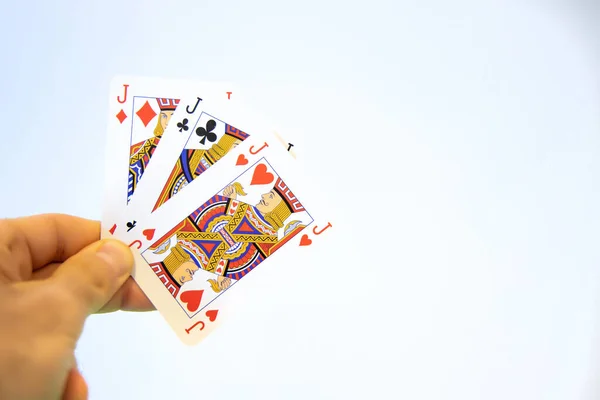 Mão Segurando Trio Cartas Jack Poker Sobre Fundo Branco — Fotografia de Stock