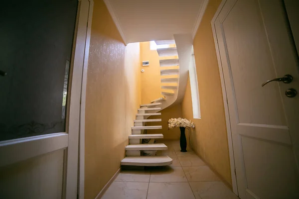 Stairs leading to the upper, low level. Interior design