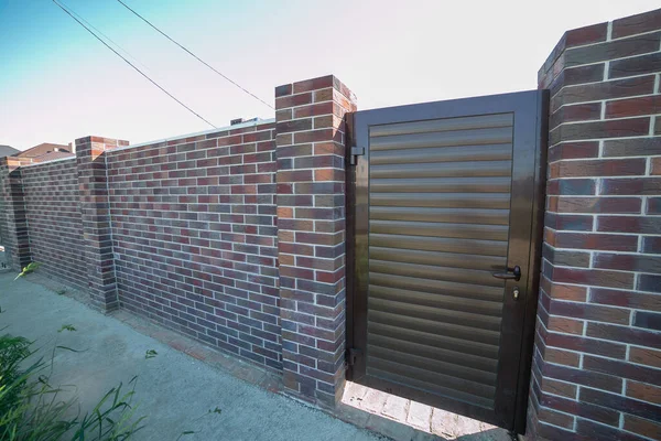 Front View of one floor single family house.fence. gate