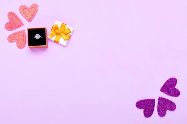 Decorations and gift box with ring — Stock Photo, Image