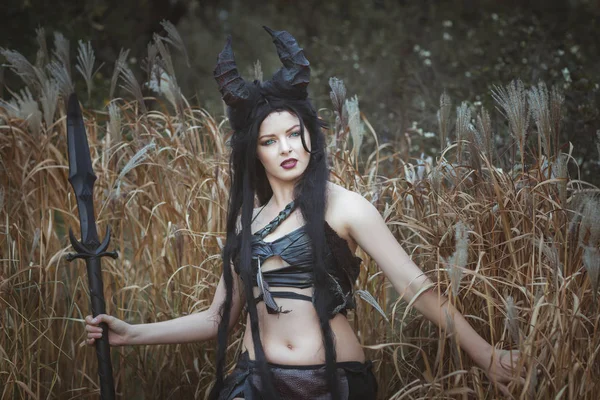 Beautiful wild girl with horns — Stock Photo, Image