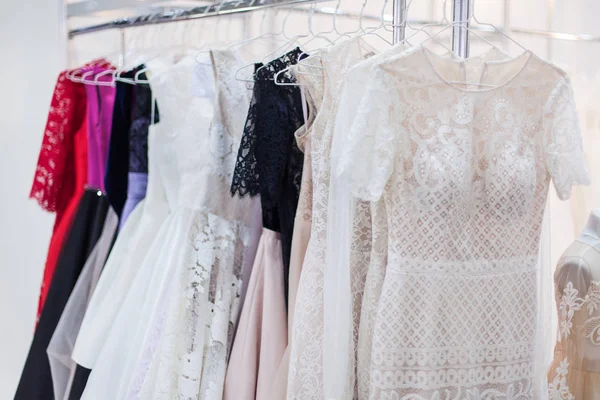 Rack with lots of beautiful dresses. — Stock Photo, Image