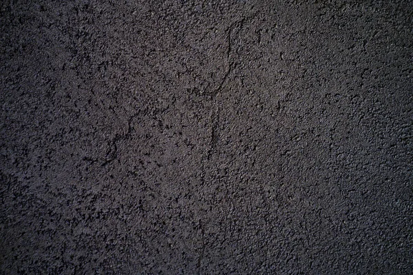 abstract textured dark gray or black surface texture rough background, cement concrete floor or wall
