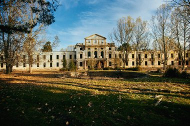 Tbilisi, Georgia October 27, 2019 - Old abandoned resort hotel in Borjomi, Georgia. Golden autumn leaves and beautiful scenery around.