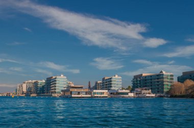 Abu Dhabi, United Arab Emirates October 10, 2017: Glass residential housing near water