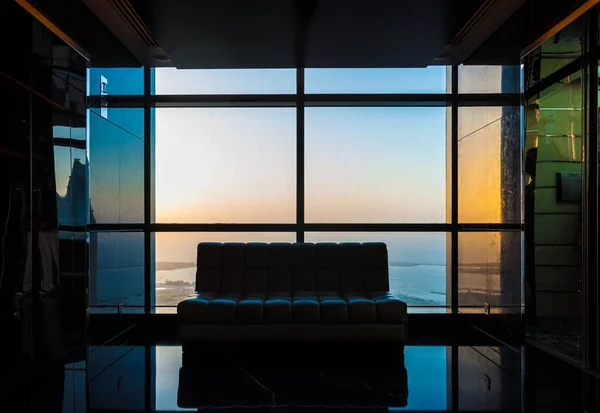 Abu Dhabi, United Arab Emirates October 10, 2017: Lounge chair in a luxurious penthouse with a view