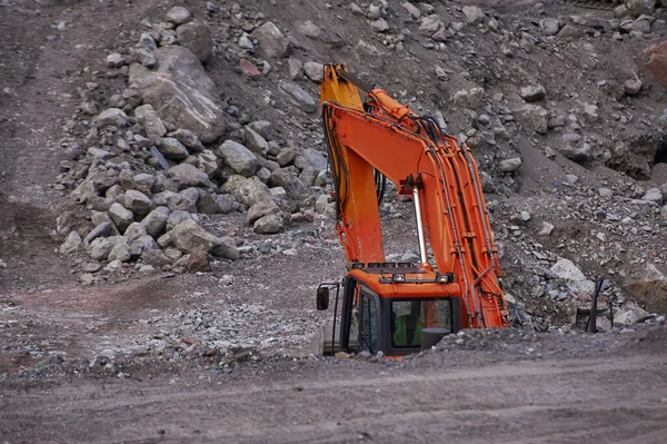 Excavator digging ground in the mountains