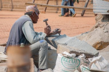 Kathmandu, Nepal - February 25, 2018: Stone carver working on his craft