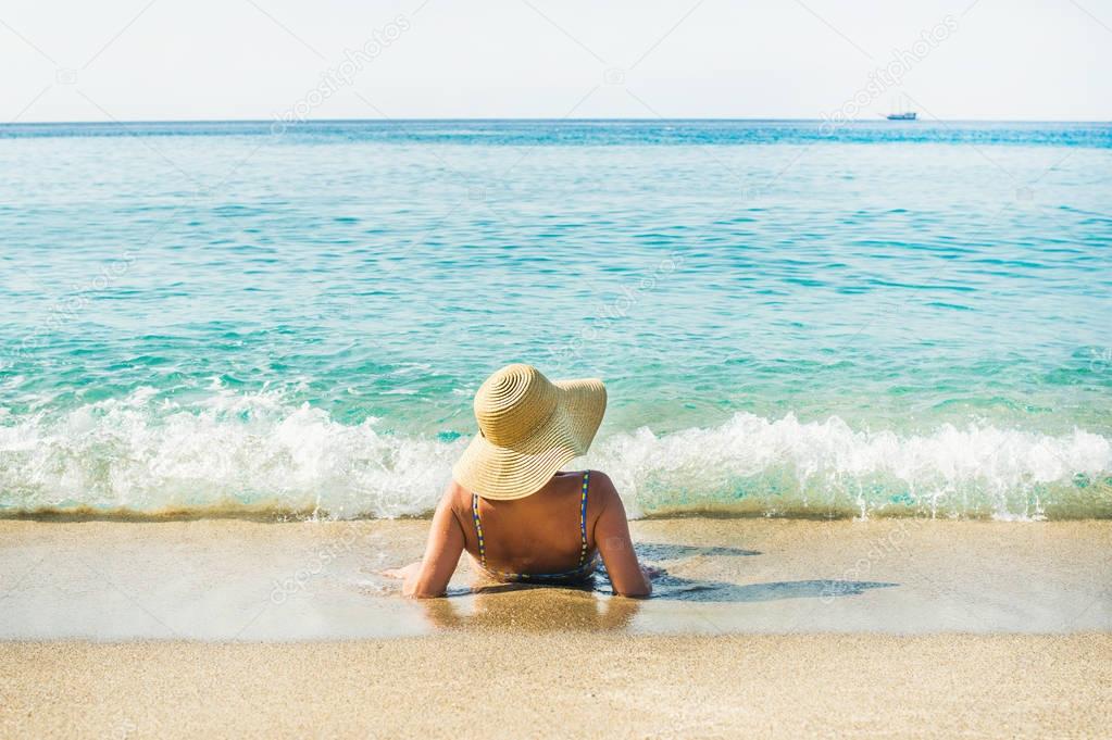 Woman lying on sand