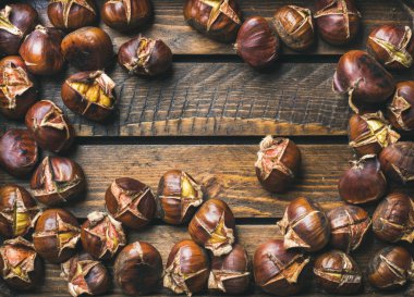 Roasted chestnuts on table clipart