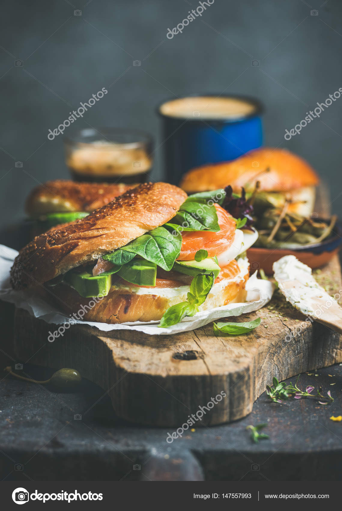 Bagel with salmon on cutting board Stock Photo by ©sonyakamoz 147557993