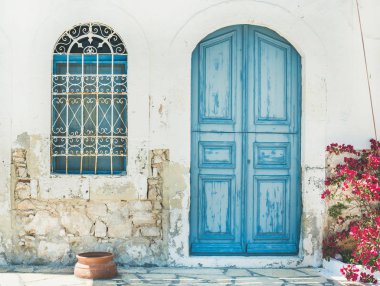 Greek traditional street with blue door clipart