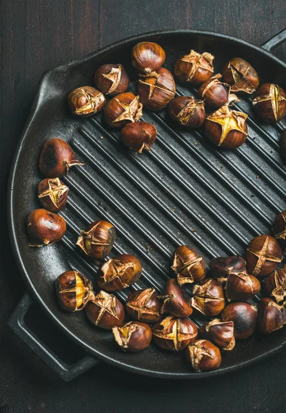 Roasted chestnuts in grilling pan — Stock Photo, Image