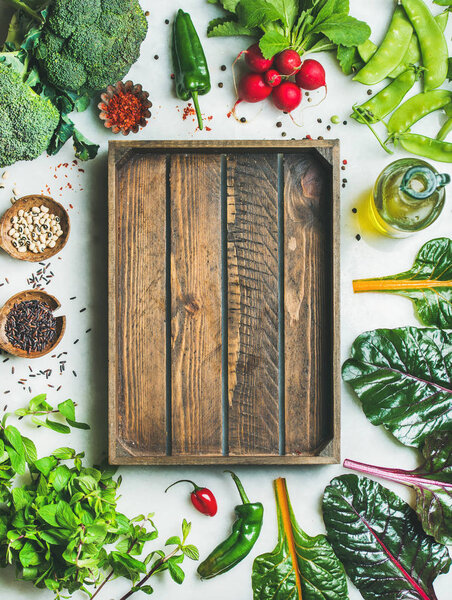 Fresh greens with wooden box