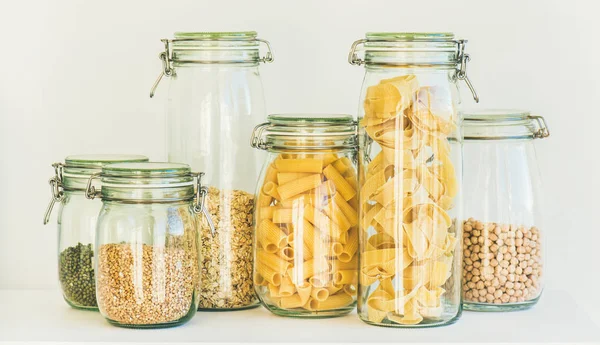 Various Uncooked Cereals Grains Beans Pasta Healthy Cooking Glass Jars — Stock Photo, Image