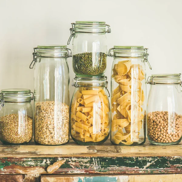 Various Uncooked Cereals Grains Beans Pasta Healthy Cooking Glass Jars — Stock Photo, Image