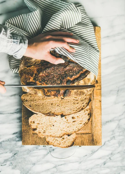 Woman Hands Cutting Freshly Baked Sourdough Bread Knife Pieces Rustic — Stock Photo, Image