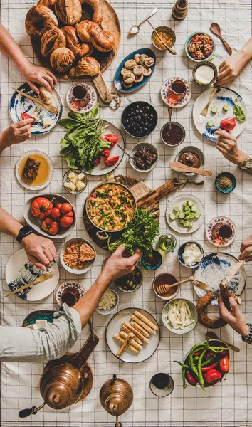 Flat Lay Family Eating Turkish Breakfast Pastries Vegetables Greens Spreads — Stock Photo, Image