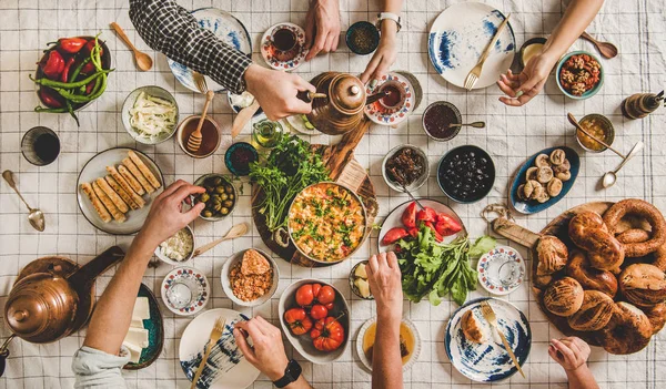 Flat Lay Family Having Turkish Breakfast Pastries Vegetables Greens Spreads — 스톡 사진