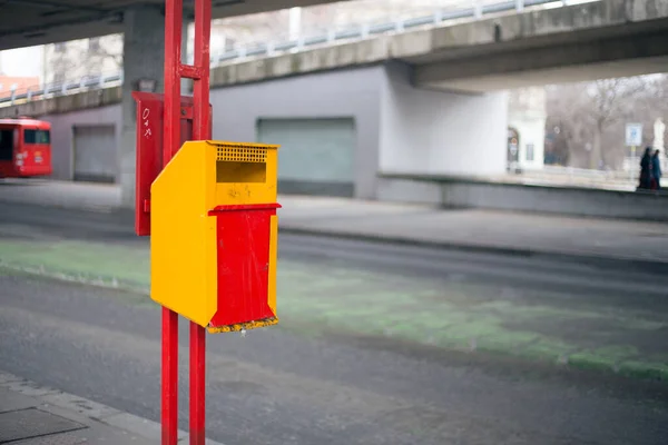 Yellow garbage bin on the street in Bratislava