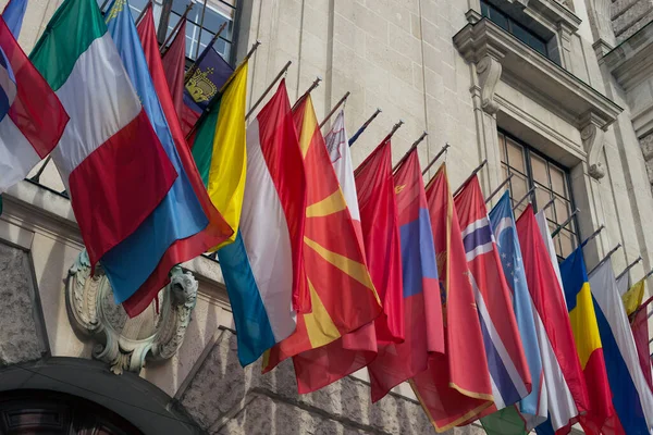 European flags on the facade of an old building