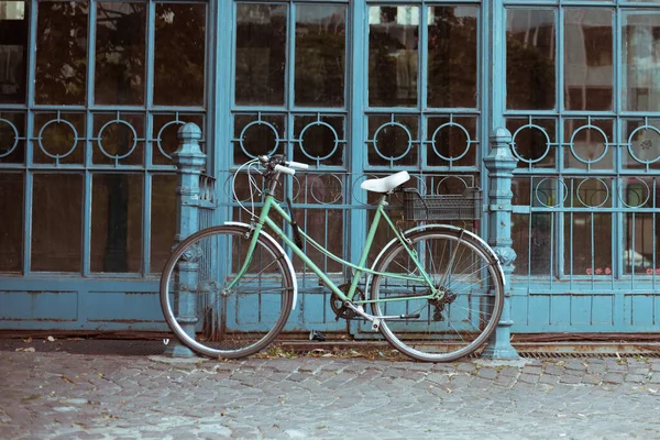 Old vintage walking bike in the city
