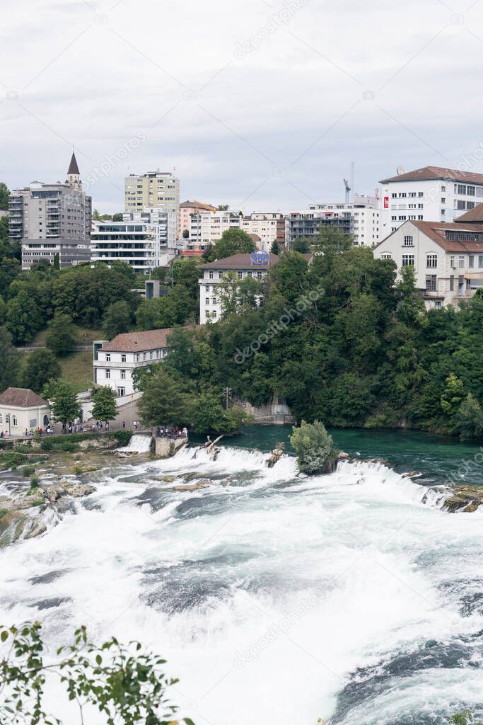 View of a waterfall in the old European city of Schaffhausen