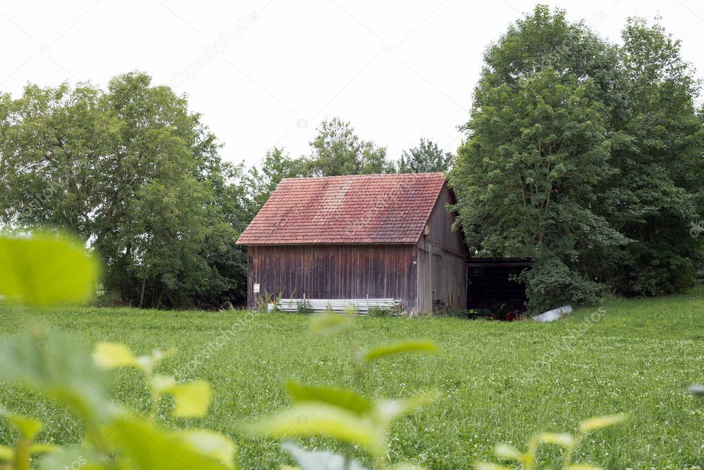 Old wooden house near the field in europe