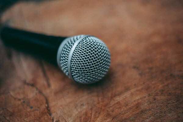 Wired microphone for vocals on a wooden table
