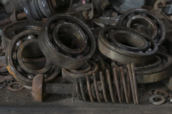 Old and abandoned bearing kits in a car workshop